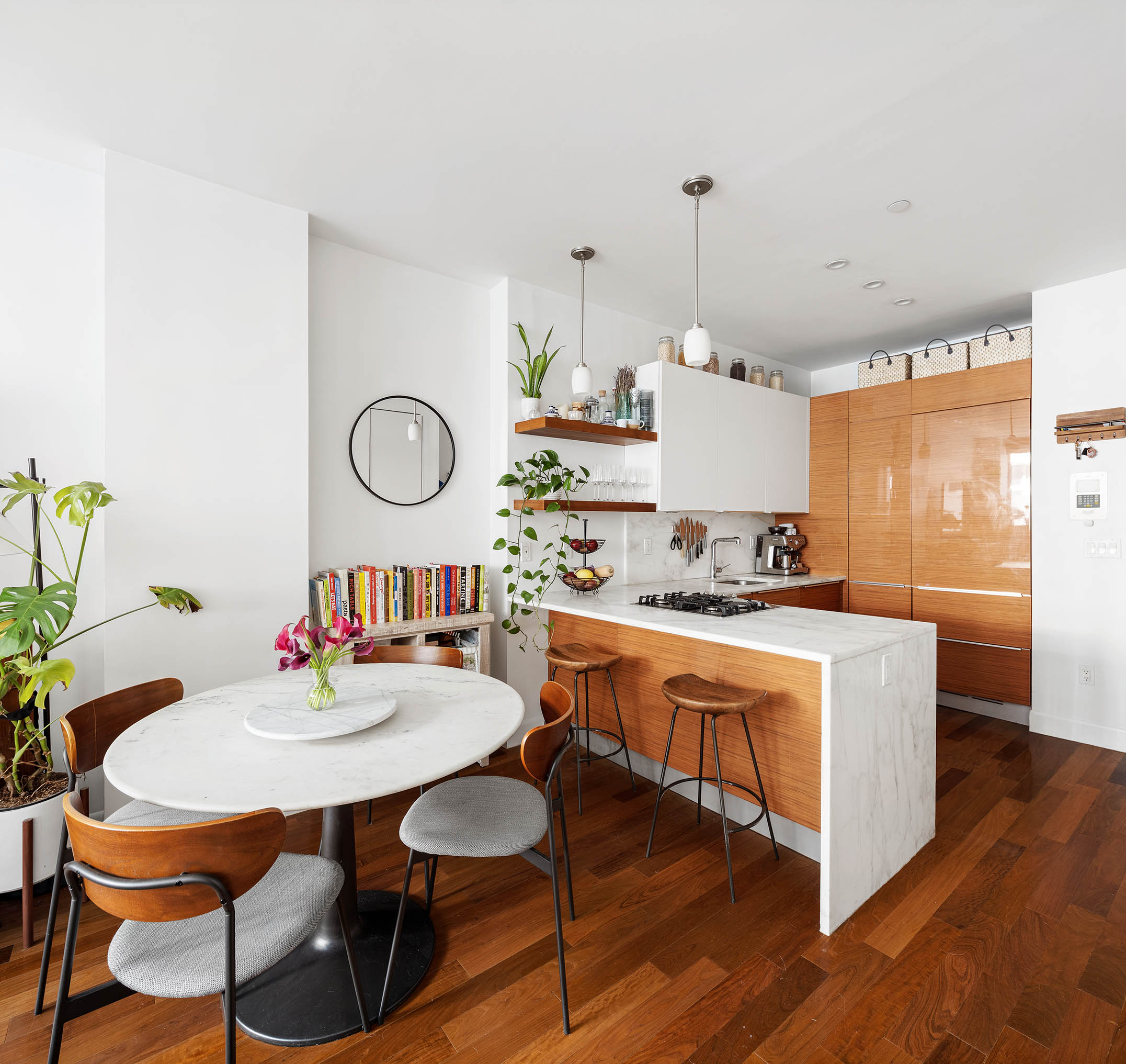 130 West 20th Street, Unit 1B Manhattan, NY 10011 - Photo 3 of 8 a large kitchen with a table and chairs