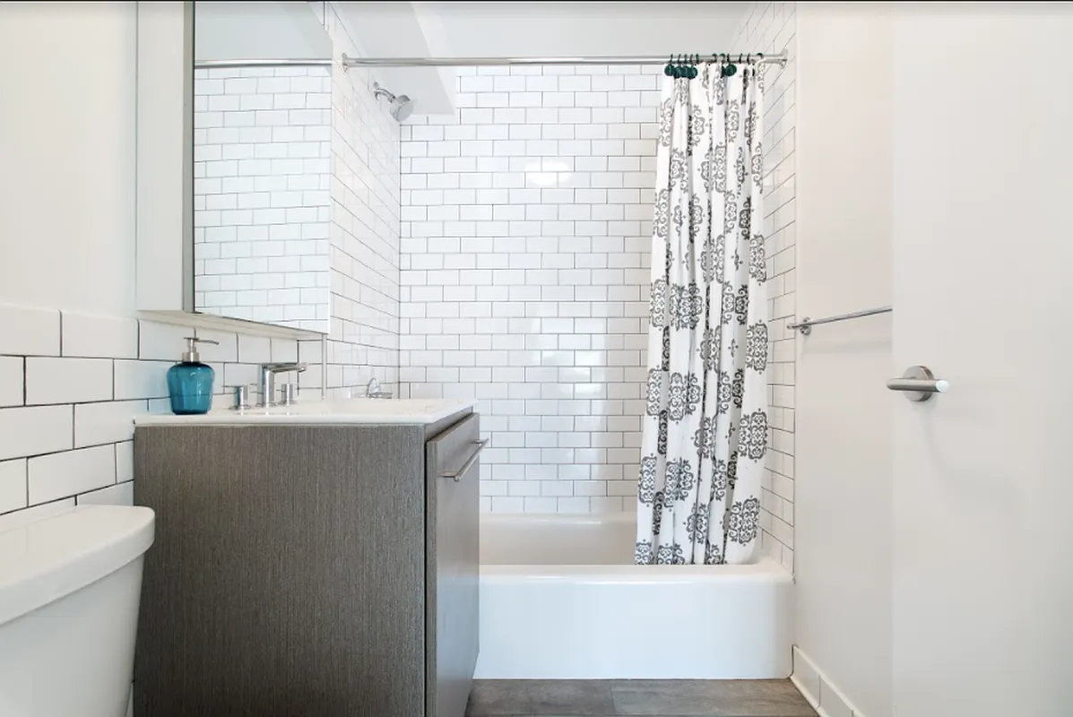 204 Huntington Street, Unit 3E Brooklyn, NY 11231 - Photo 5 of 13 a bathroom with a bathtub and a sink
