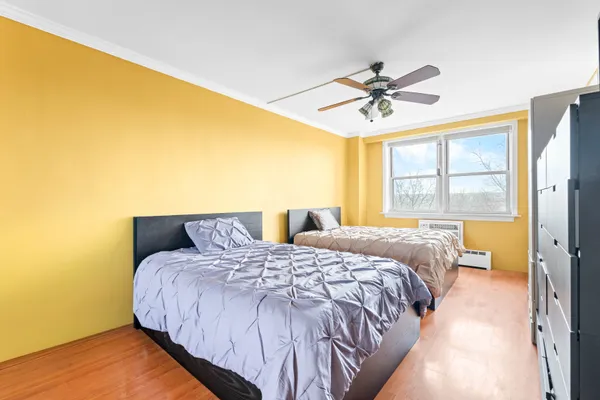 a bedroom with a bed and window