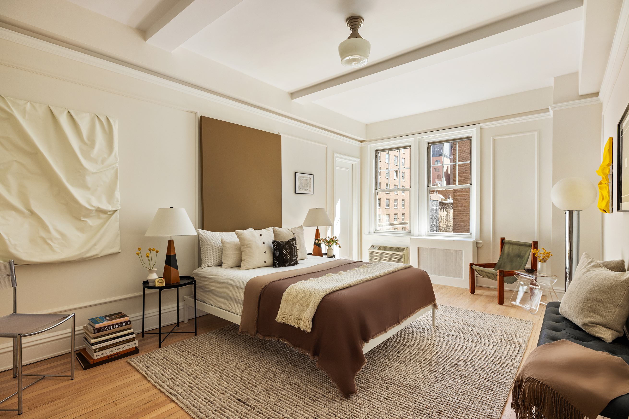 30 5th Avenue, Unit 6H Manhattan, NY 10011 - Photo 10 of 17 a bedroom with a bed wooden floor and window