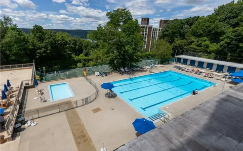 a terrace of a house with outdoor seating