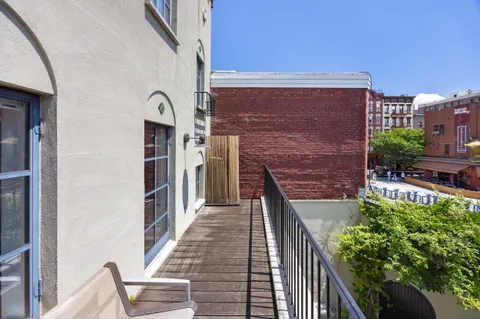a view of a balcony with an outdoor space