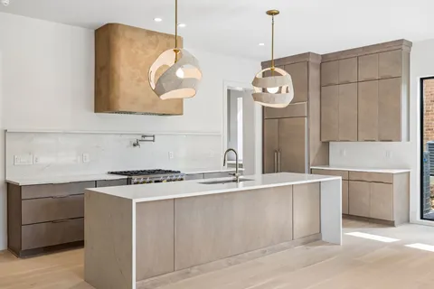 a very nice looking kitchen with a large window
