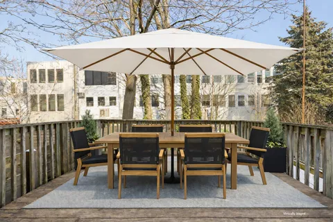 a view of a dinning table and chairs in the patio