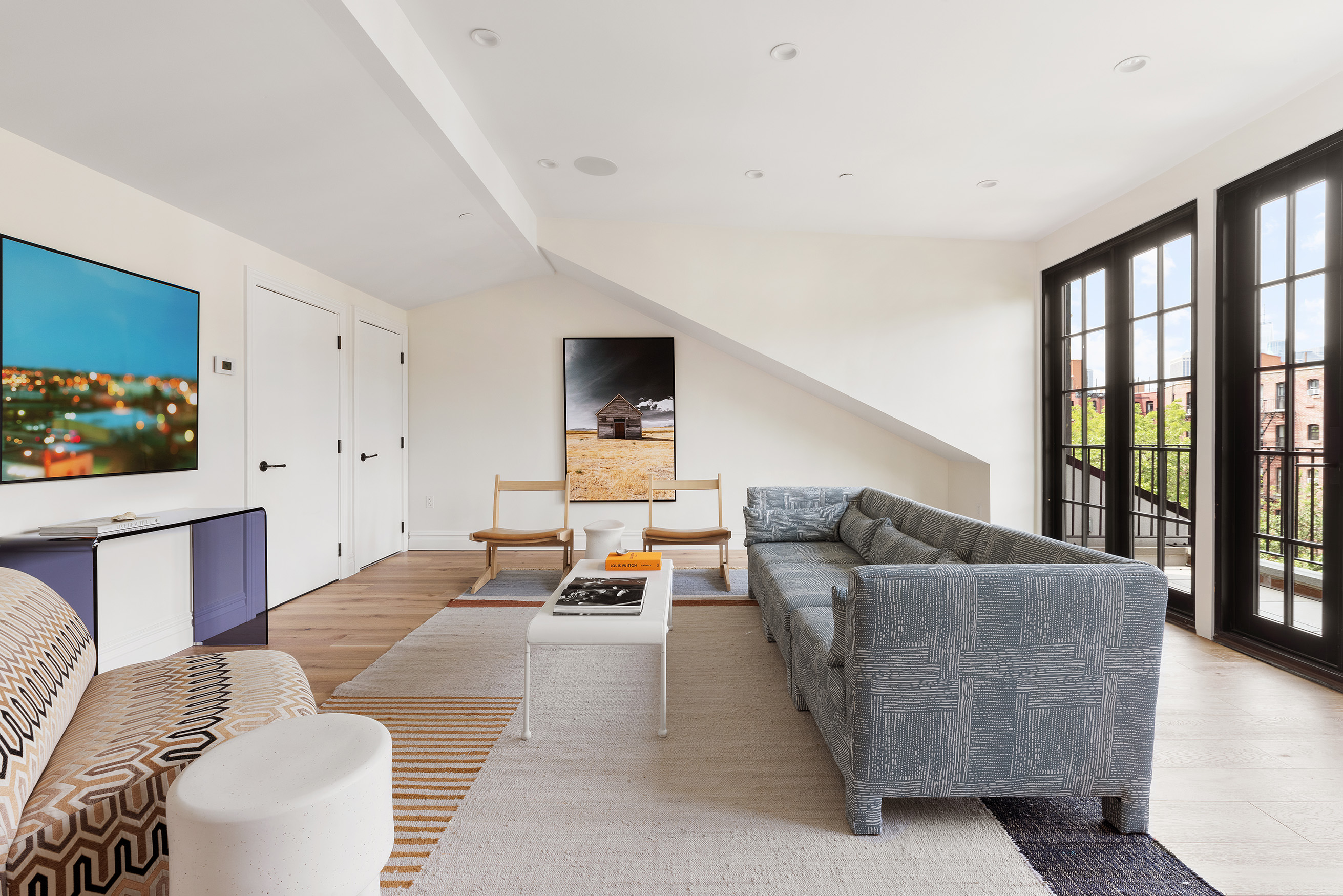 149 Kane Street Brooklyn, NY 11231 - Photo 22 of 26 a living room with furniture and a flat screen tv