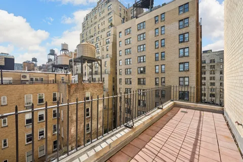 a view of a balcony with wooden floor