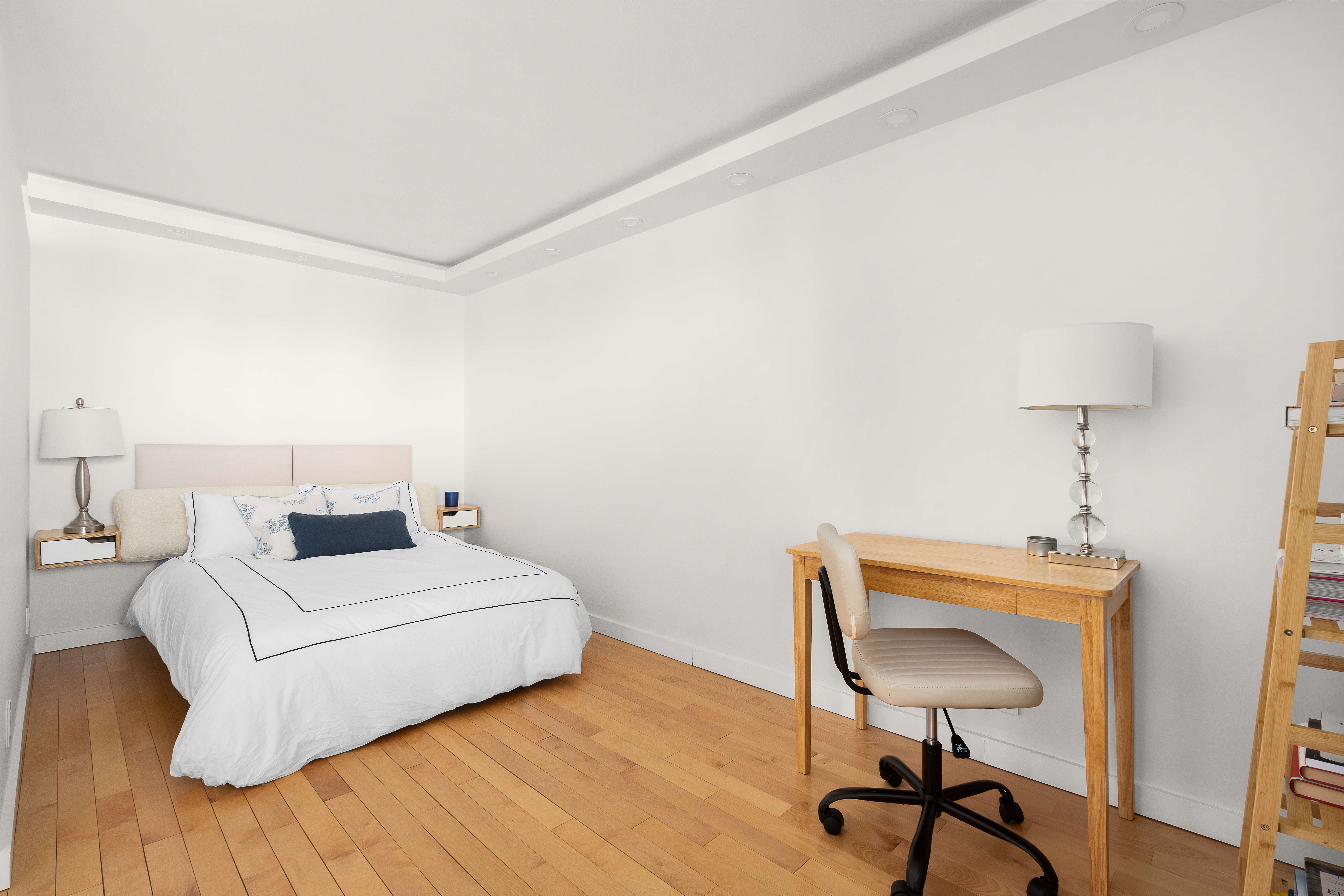 75 Henry Street, Unit 23D Brooklyn, NY 11201 - Photo 5 of 8 a room with a bed and a chair