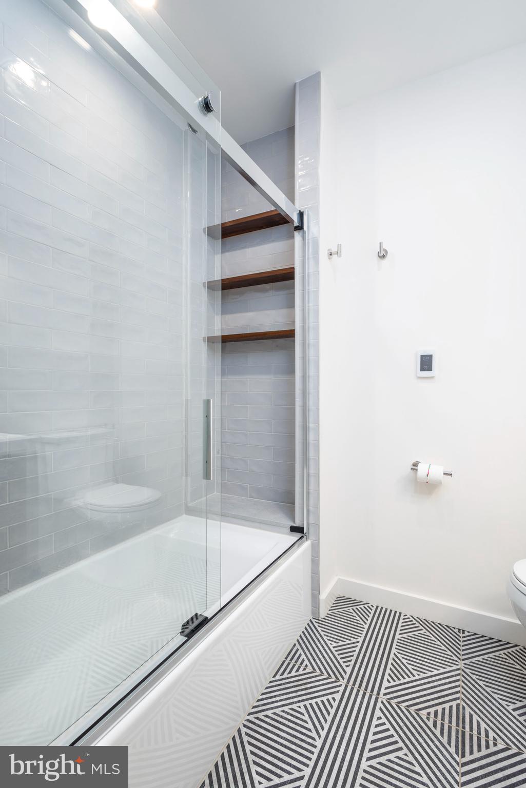 283 Locust Street Philadelphia, PA 19106 - Photo 26 of 33 a bathroom with a bathtub and a shower