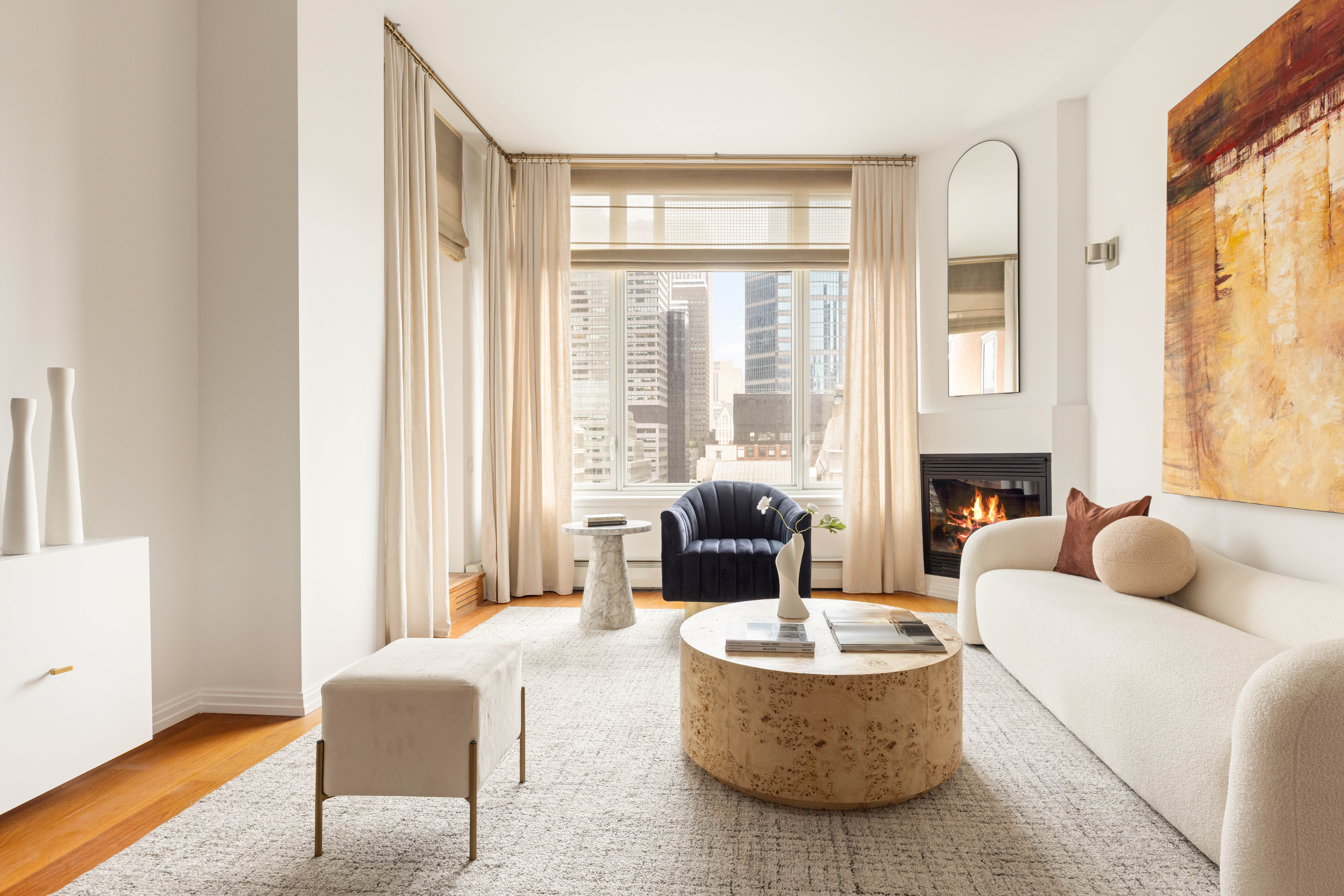 205 East 59th Street, Unit 14B Manhattan, NY 10022 - Photo 3 of 19 a living room with fireplace furniture and a large window