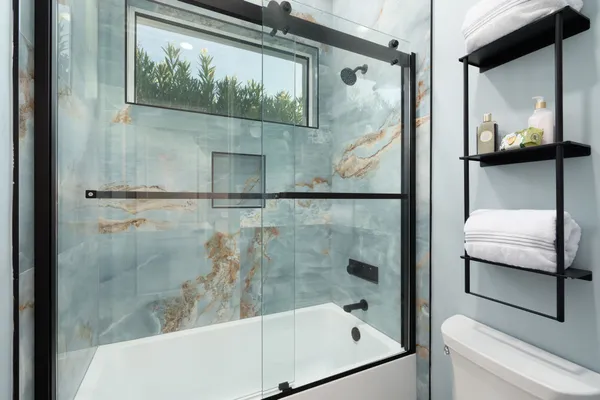 a view of a lake with couches chairs