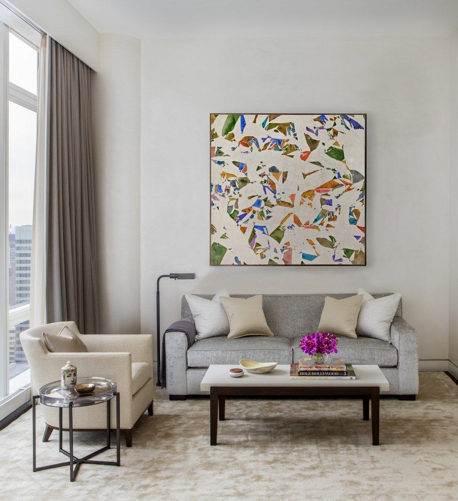 20 West 53rd Street, Unit 42A Manhattan, NY 10019 - Photo 24 of 31 a living room with furniture and a potted plant