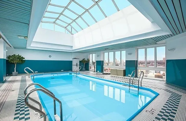 a kitchen with stainless steel appliances granite countertop a sink and cabinets