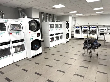 a view of a storage and utility room with washer and dryer