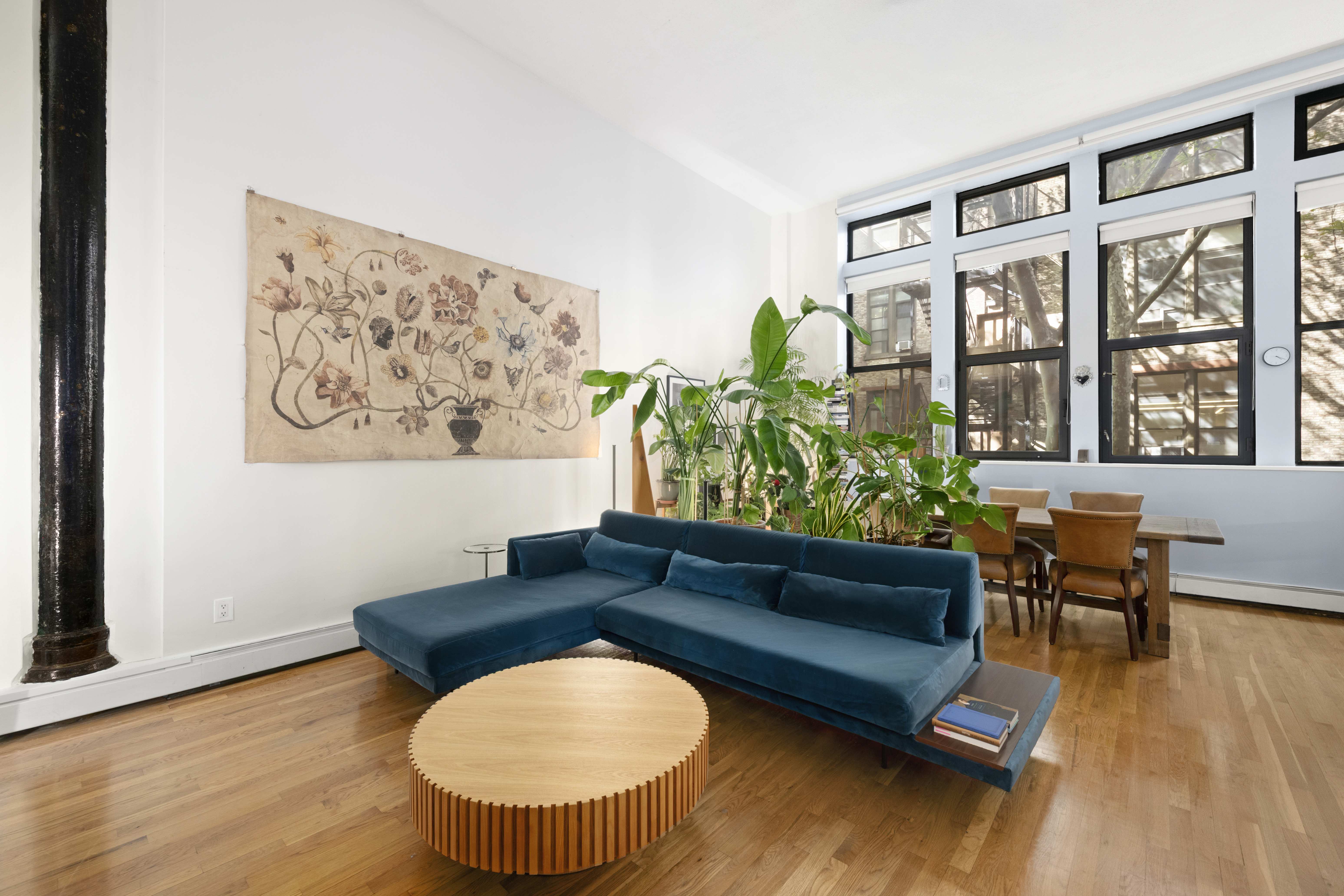 309 East 108th Street, Unit 2/D Manhattan, NY 10029 - Photo 2 of 12 a living room with furniture and a large window