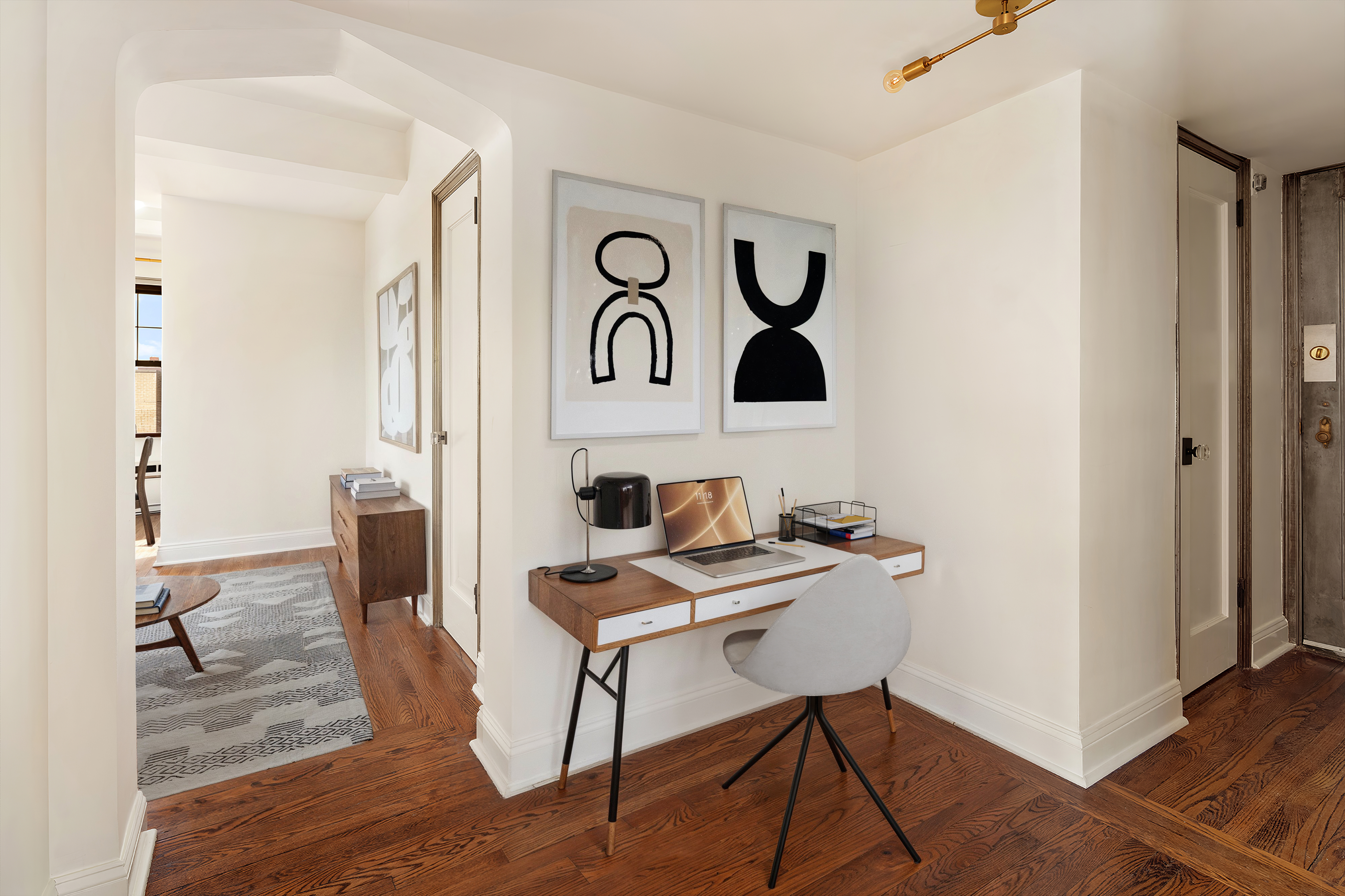 200 East 16th Street, Unit 16L Manhattan, NY 10003 - Photo 4 of 12 a view of a workspace with furniture