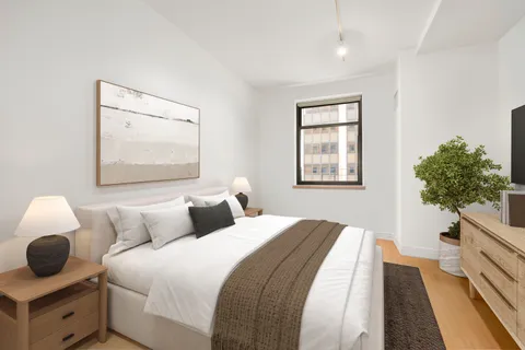 a bedroom with bed and window