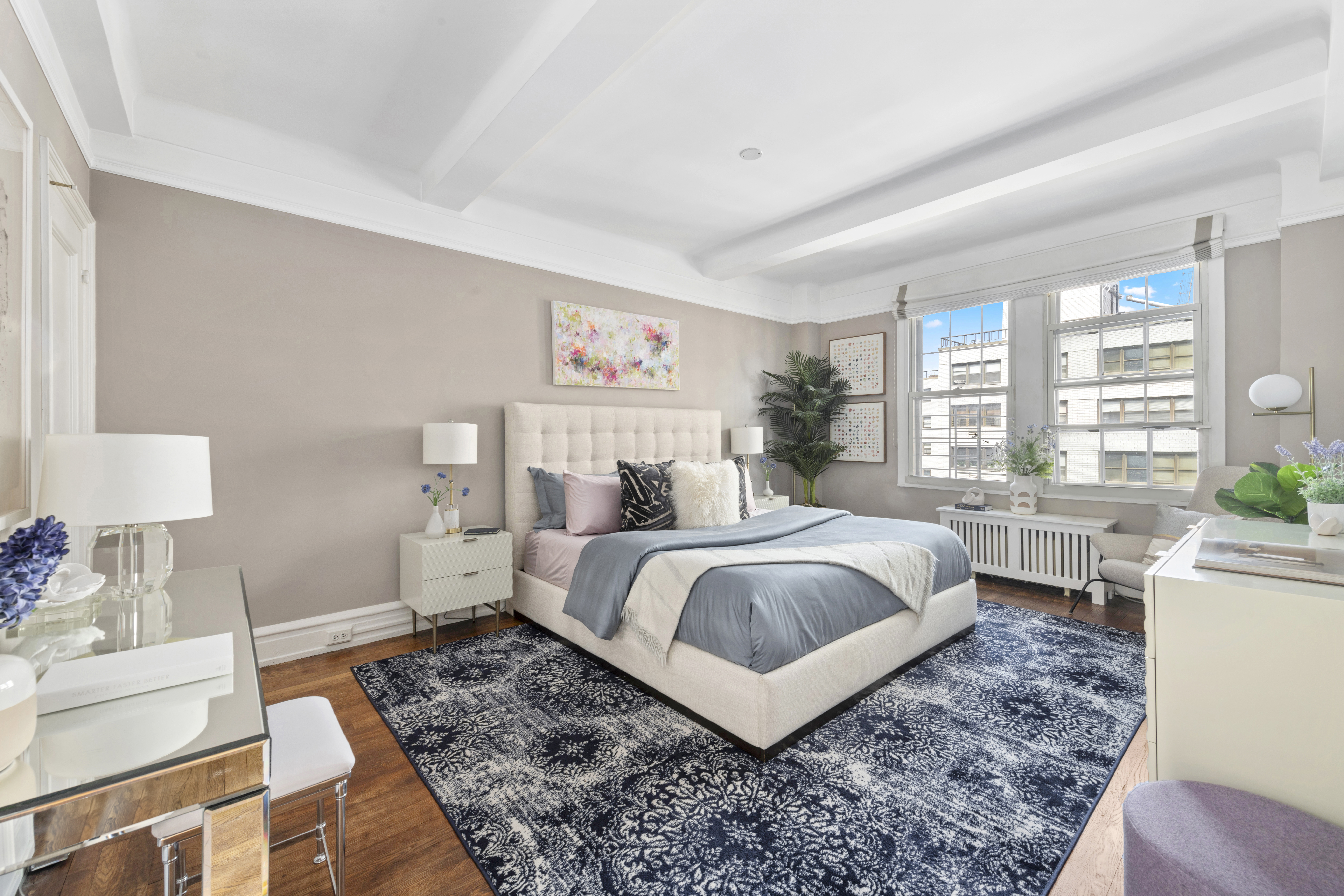 410 East 57th Street, Unit 15BE Manhattan, NY 10022 - Photo 9 of 18 a bedroom with a bed and wooden floor