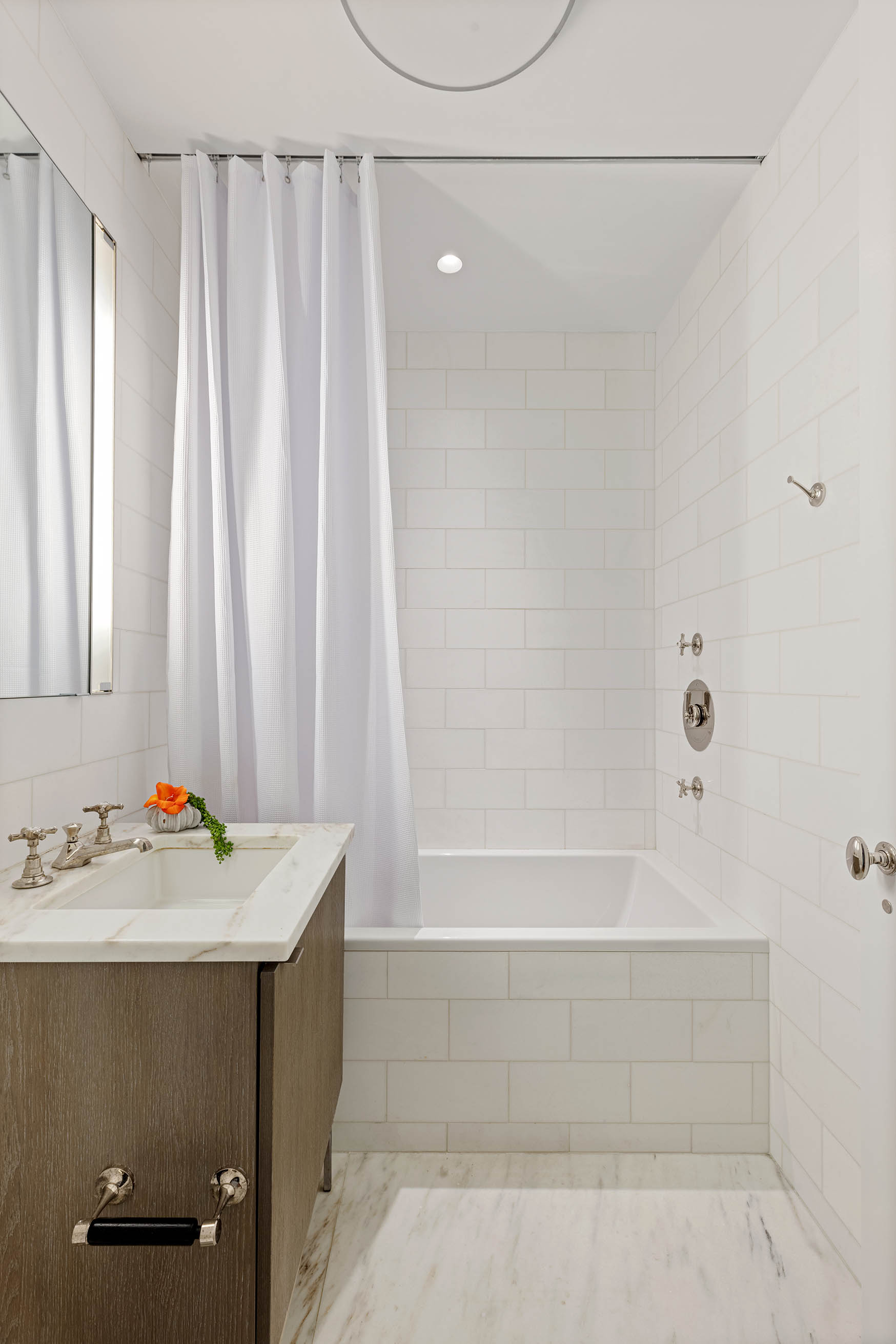 7 Harrison Street, Unit 5S Manhattan, NY 10013 - Photo 17 of 21 a bathroom with a sink and a bathtub