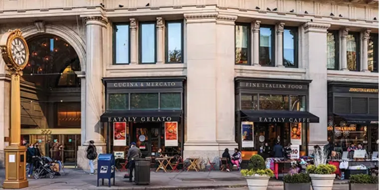 a view of a building with traffic signal lights