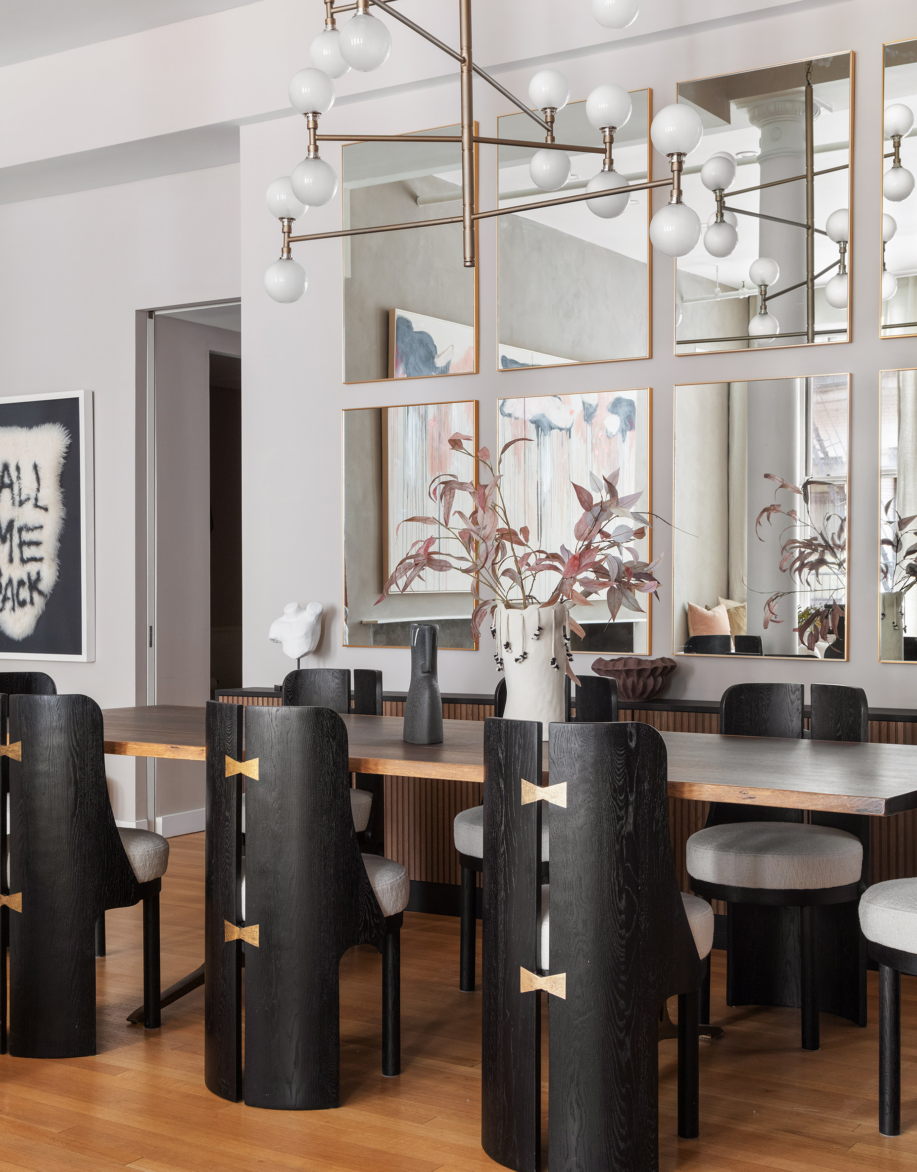 76 Crosby Street, Unit 2A Manhattan, NY 10012 - Photo 3 of 12 a view of a dining room with furniture and chandelier