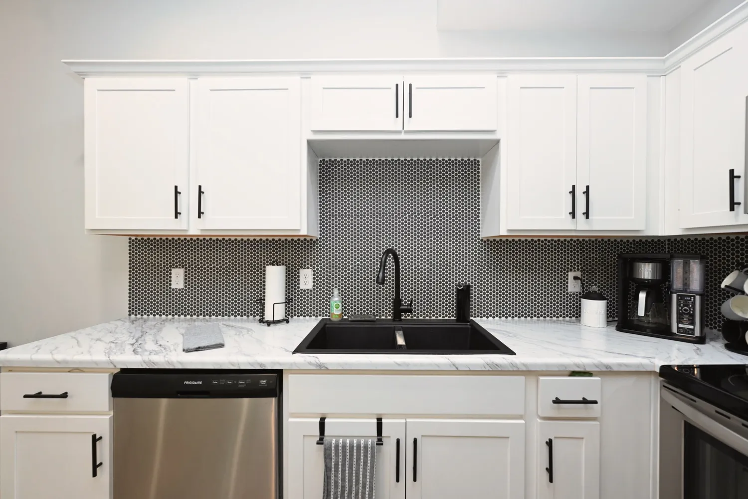 a kitchen with a sink and cabinets