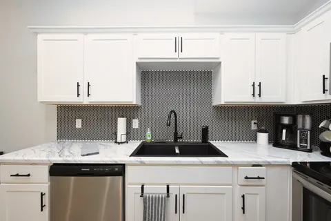 a kitchen with a sink and cabinets