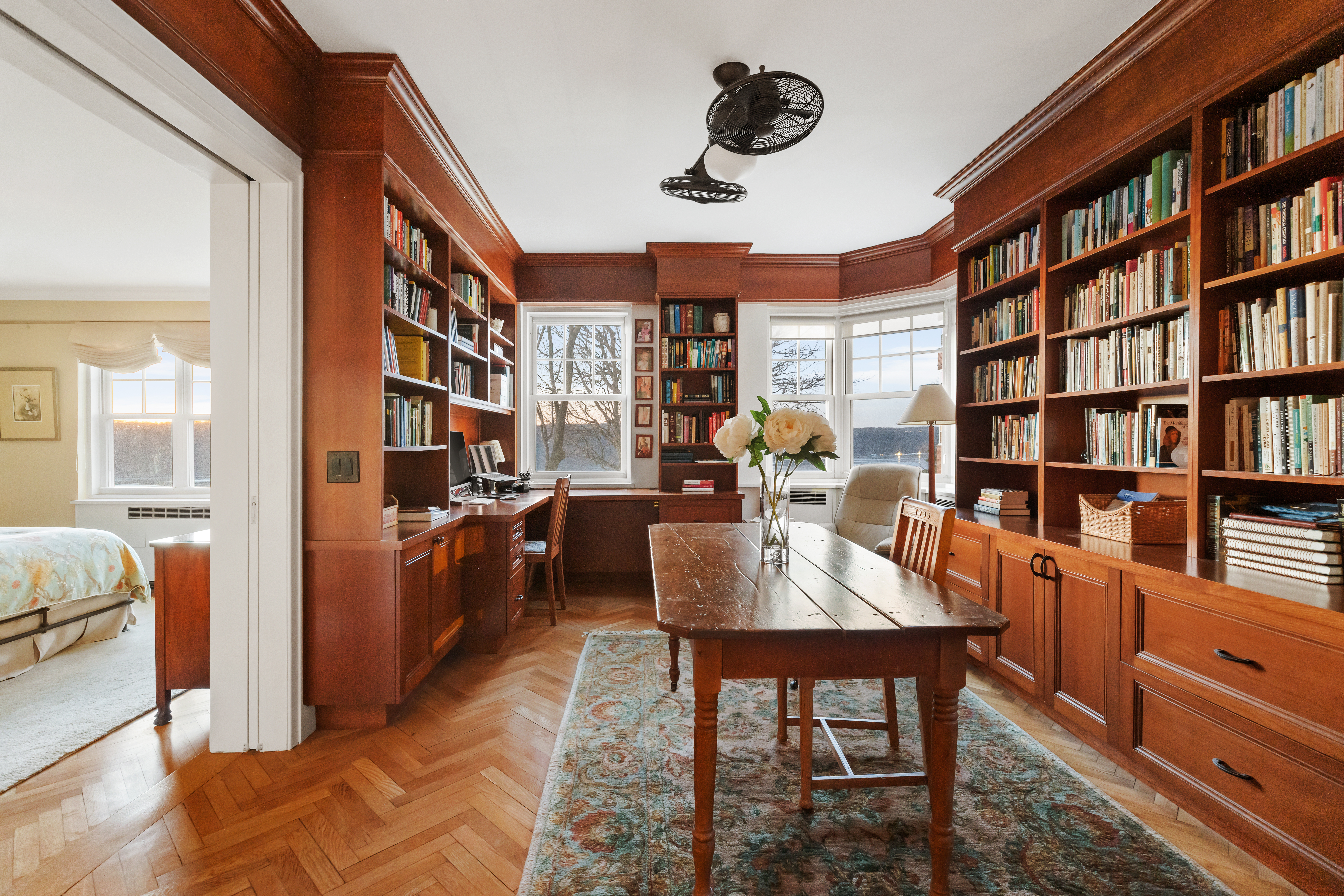 140 Cabrini Boulevard, Unit 18/19 Manhattan, NY 10033 - Photo 1 of 21 a dining room with furniture a book shelves and a book shelf