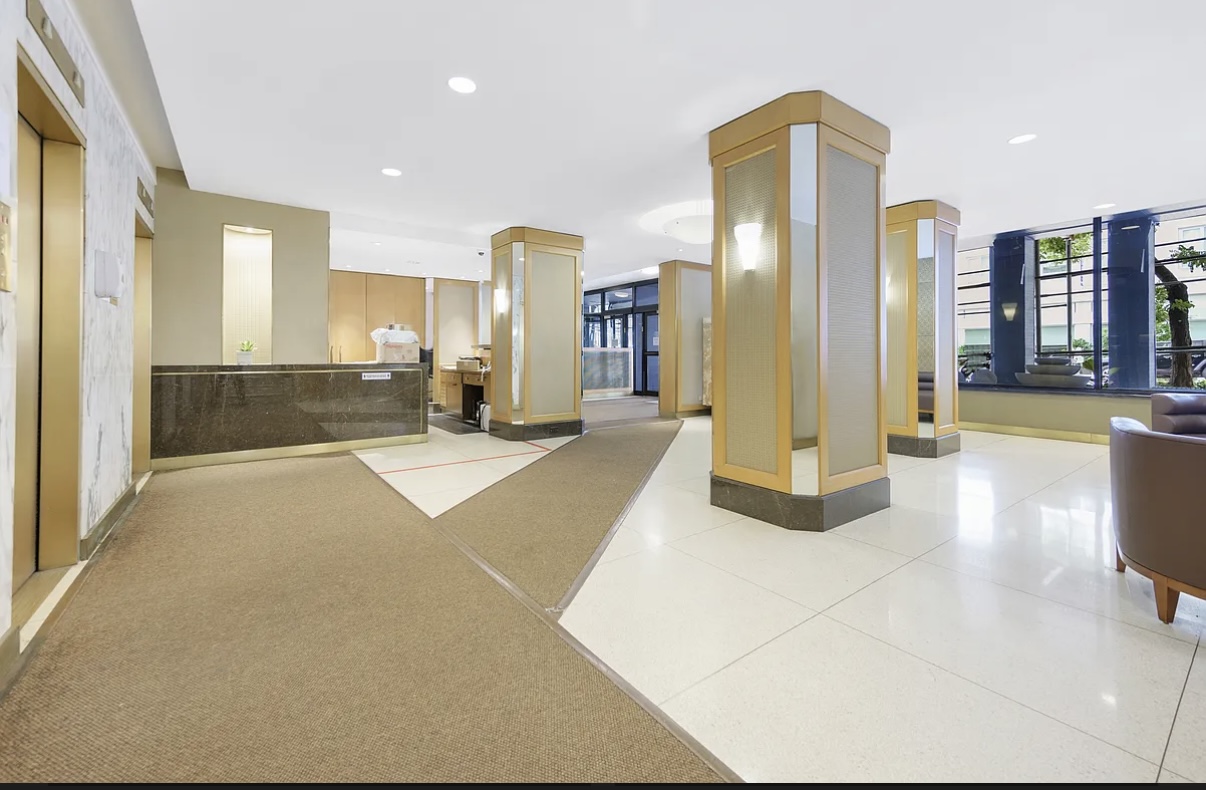155 East 34th Street, Unit 3B Manhattan, NY 10016 - Photo 10 of 11 a large bathroom with a glass door shower