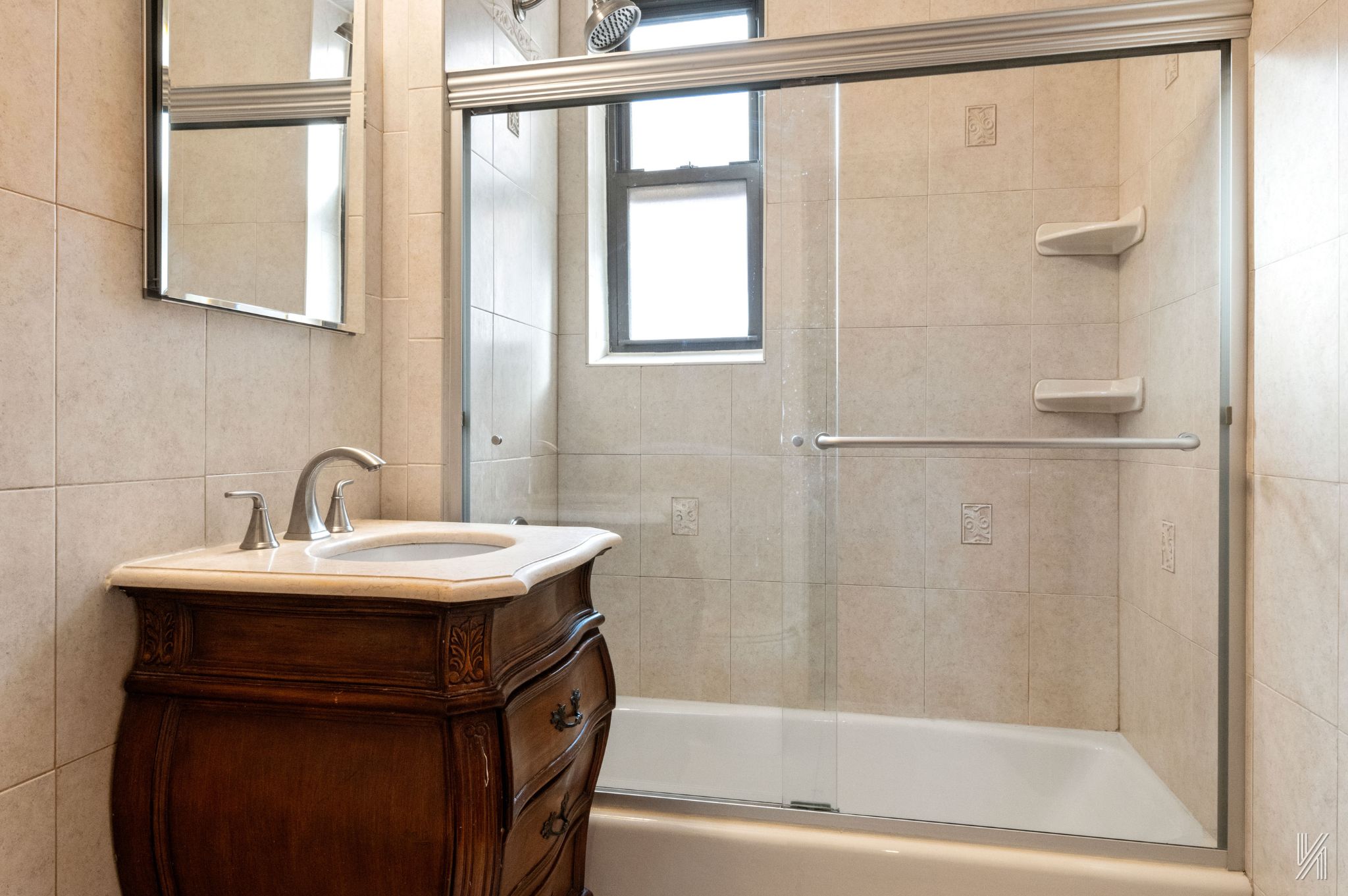 25-40 31st Avenue, Unit 6E Queens, NY 11106 - Photo 14 of 15 a bathroom with a sink and a bathtub