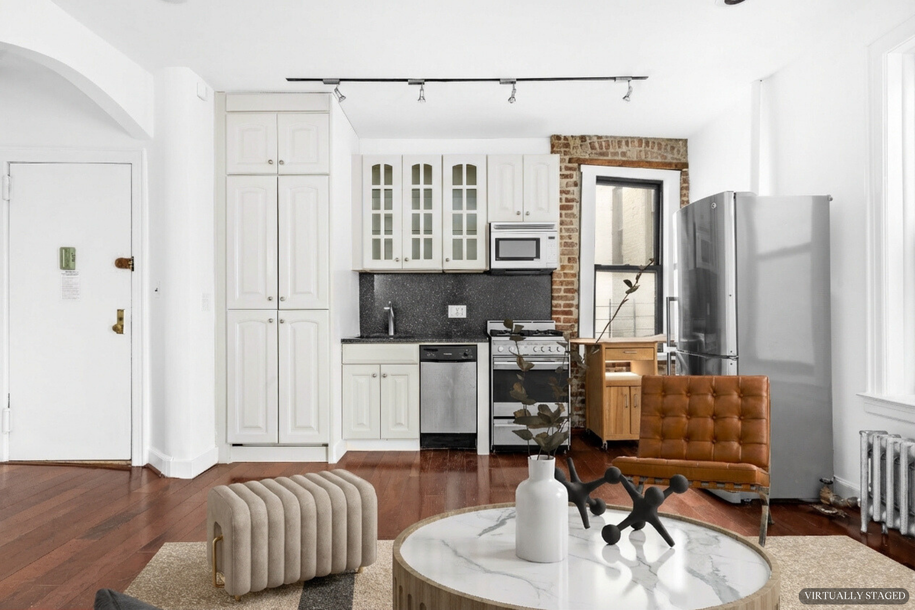 199 East 7th Street, Unit 4E Manhattan, NY 10009 - Photo 9 of 13 a living room with furniture and a flat screen tv
