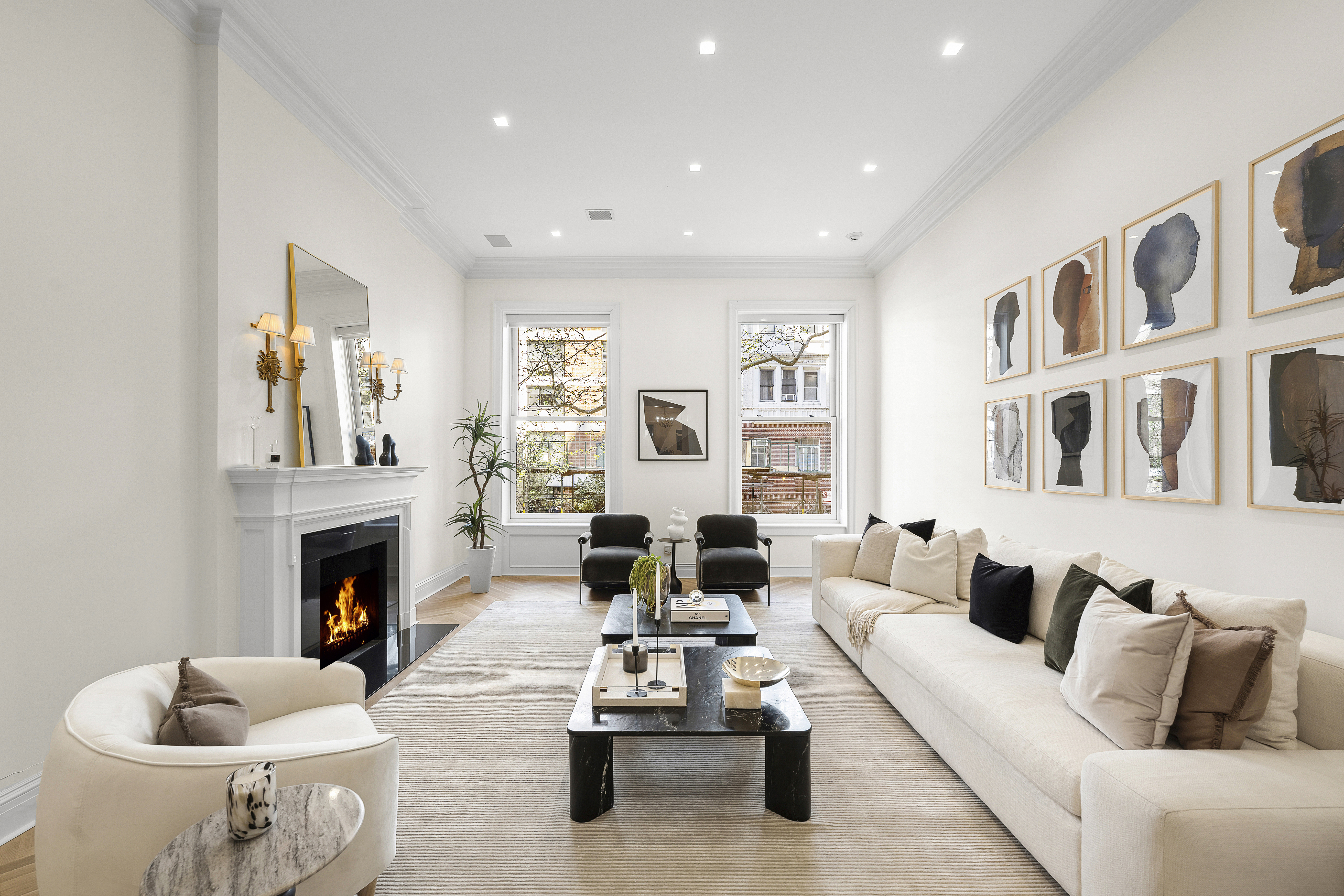 50 East 73rd Street Manhattan, NY 10021 - Photo 3 of 32 a living room with furniture fireplace and a fireplace