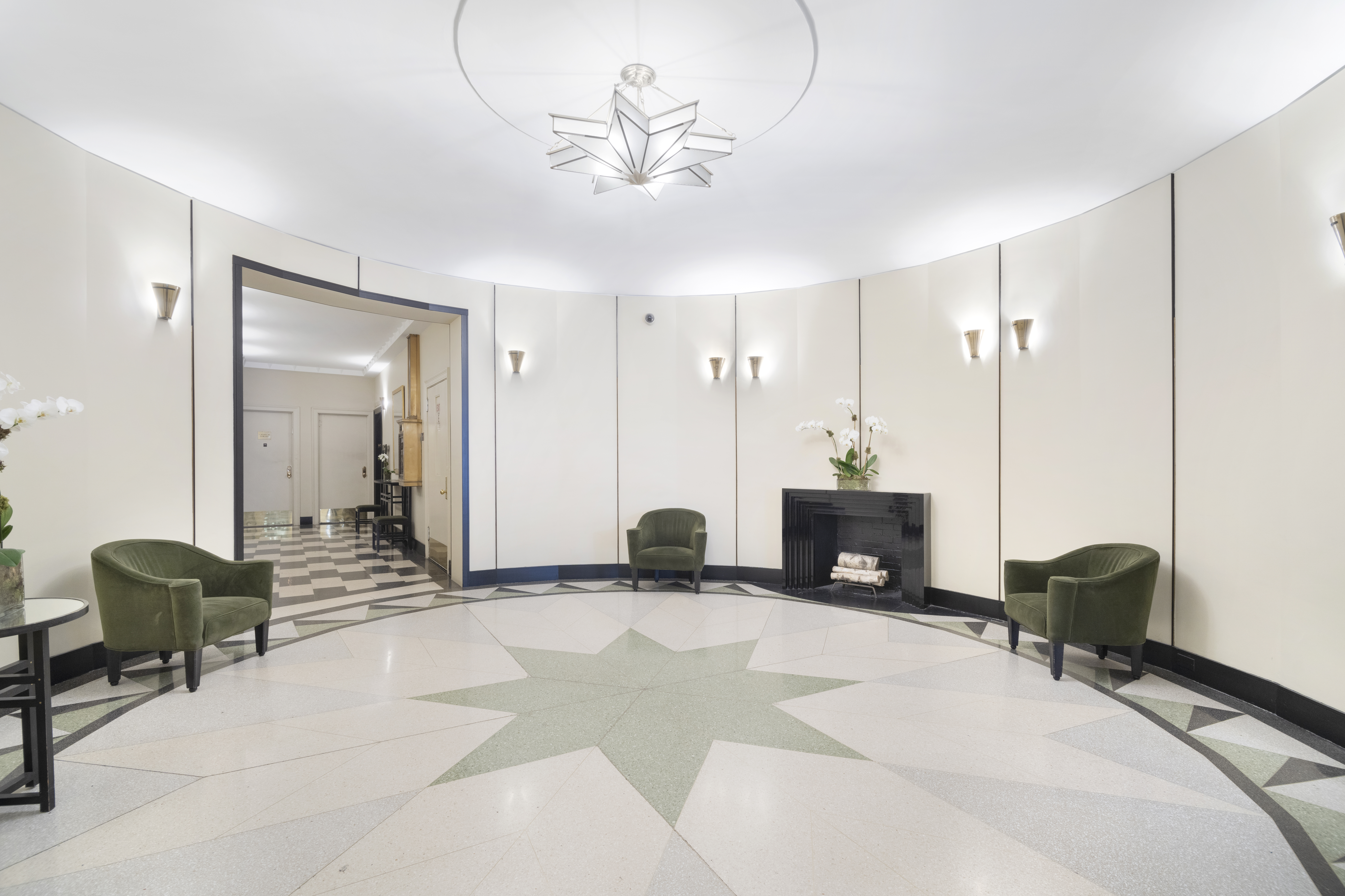 49 East 96th Street, Unit 8/9E Manhattan, NY 10128 - Photo 14 of 17 a view of a livingroom with furniture and a chandelier