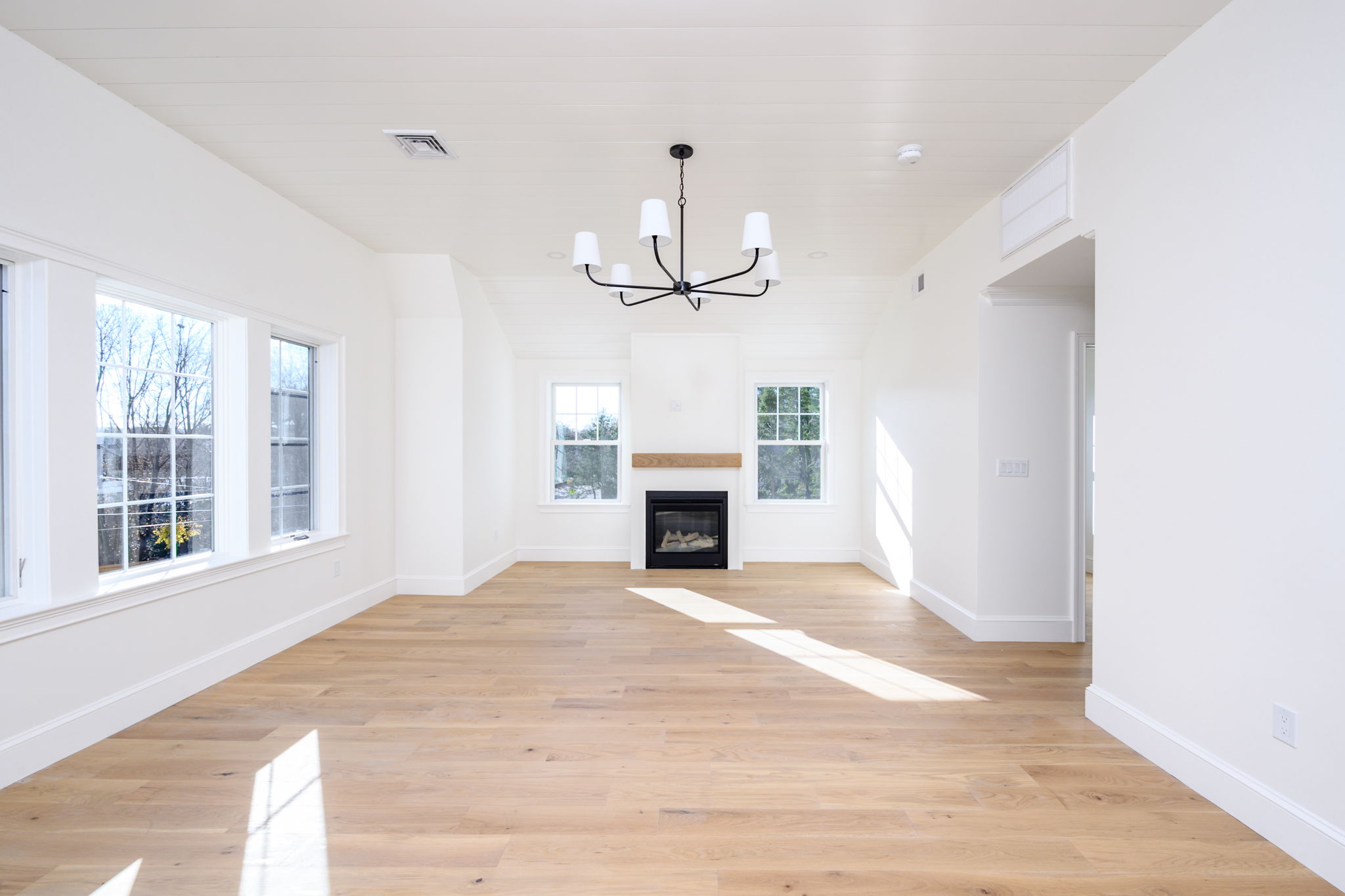 249 Central Avenue Milton, MA 02186 - Photo 28 of 61 a view of a livingroom with a fireplace and window