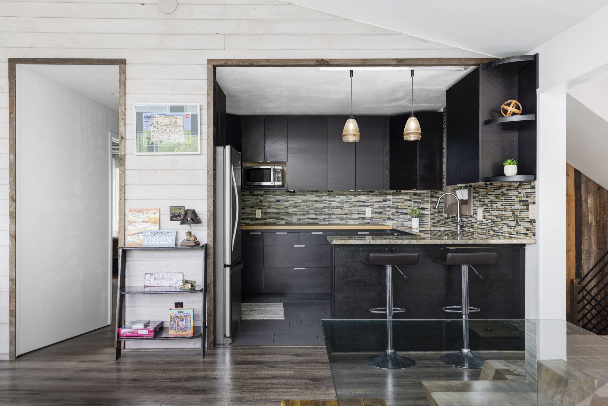 133 Gold Run Road Alma, CO 80420 - Photo 10 of 46 a kitchen with kitchen island granite countertop a sink and cabinets