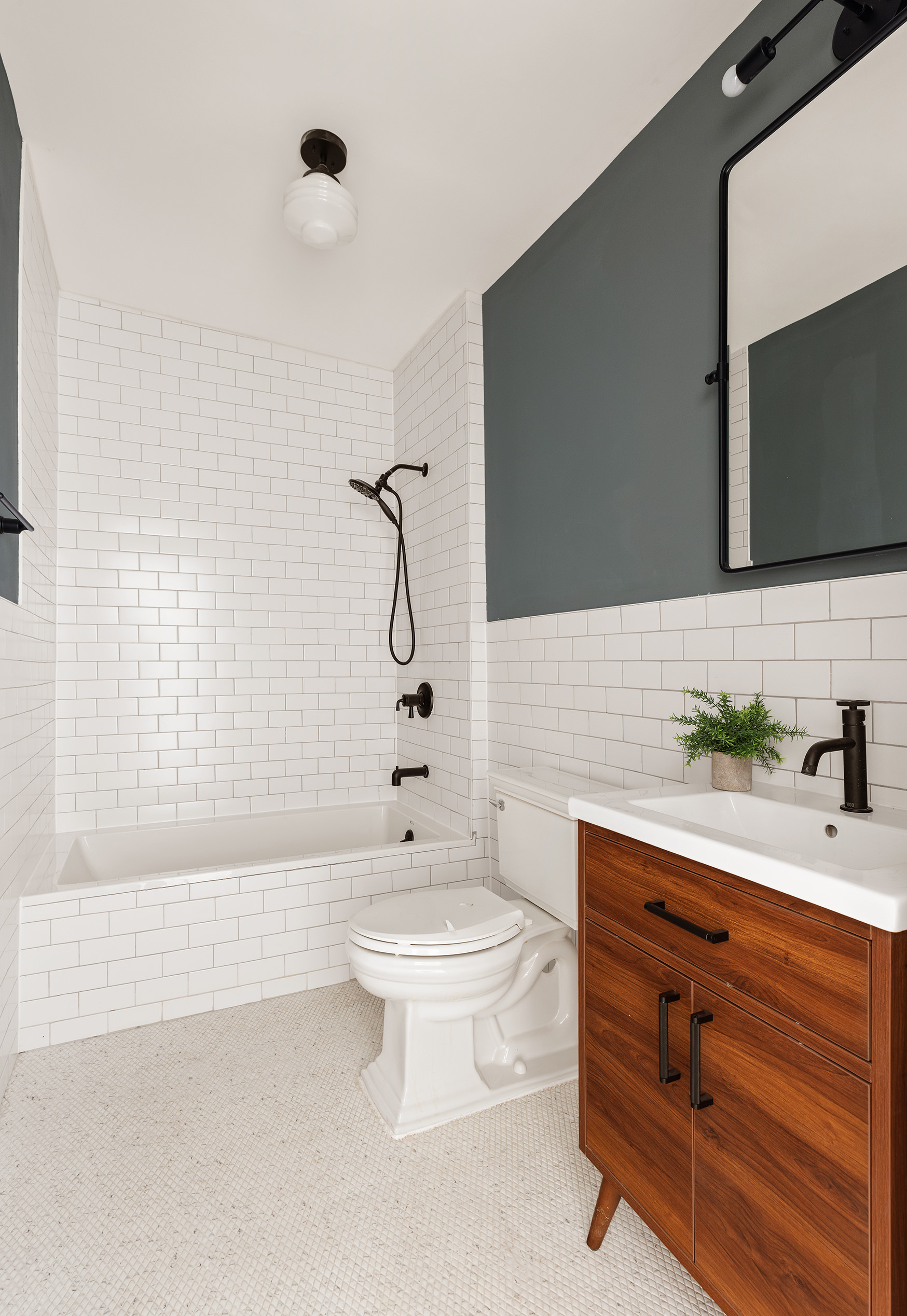 259 New York Avenue Brooklyn, NY 11216 - Photo 18 of 25 a bathroom with a sink a toilet and shower