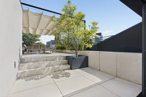 a view of balcony with a potted plant