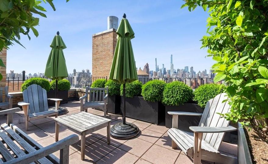 200 West 86th Street, Unit 17C Manhattan, NY 10024 - Photo 10 of 15 a view of a backyard with furniture and a garden