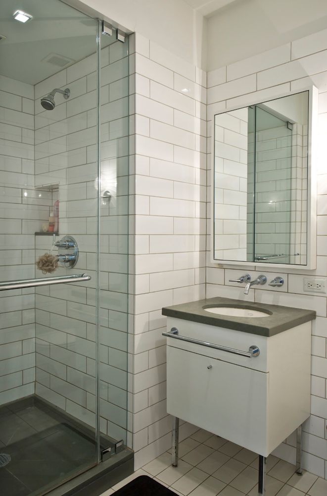 330 Spring Street, Unit 5C Manhattan, NY 10013 - Photo 8 of 18 a bathroom with a sink shower and a mirror
