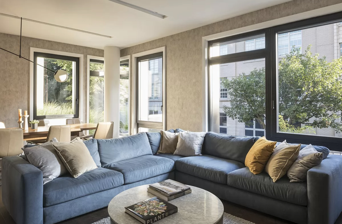 613 Baltic Street, Unit 2C Brooklyn, NY 11217 - Photo 12 of 16 a living room with furniture and a large window