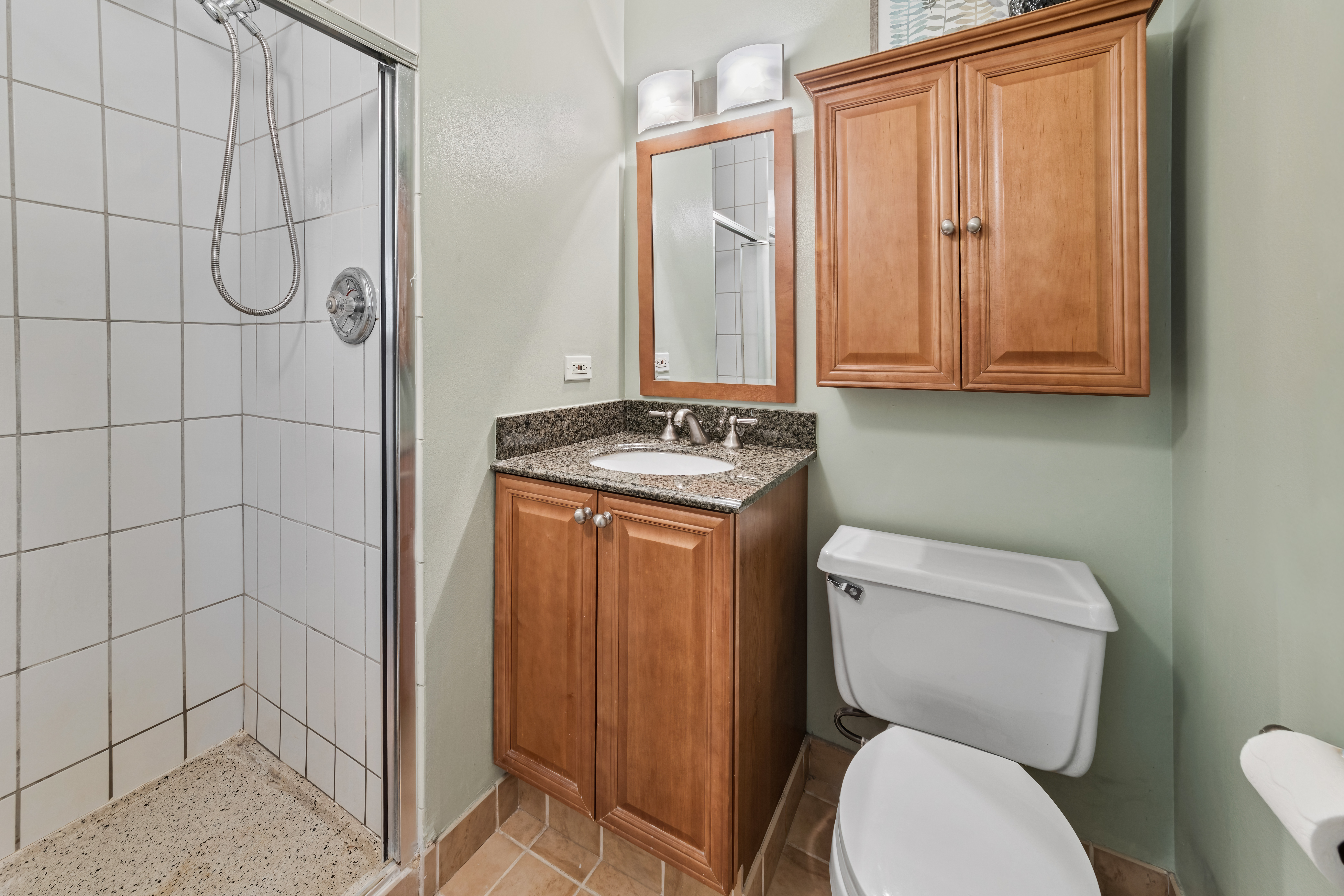 4343 North Clarendon Avenue, Unit 1016 Chicago, IL 60613 - Photo 19 of 35 a white toilet sitting next to a shower