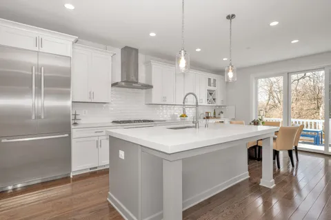 a view of a livingroom with furniture wooden floor and a window
