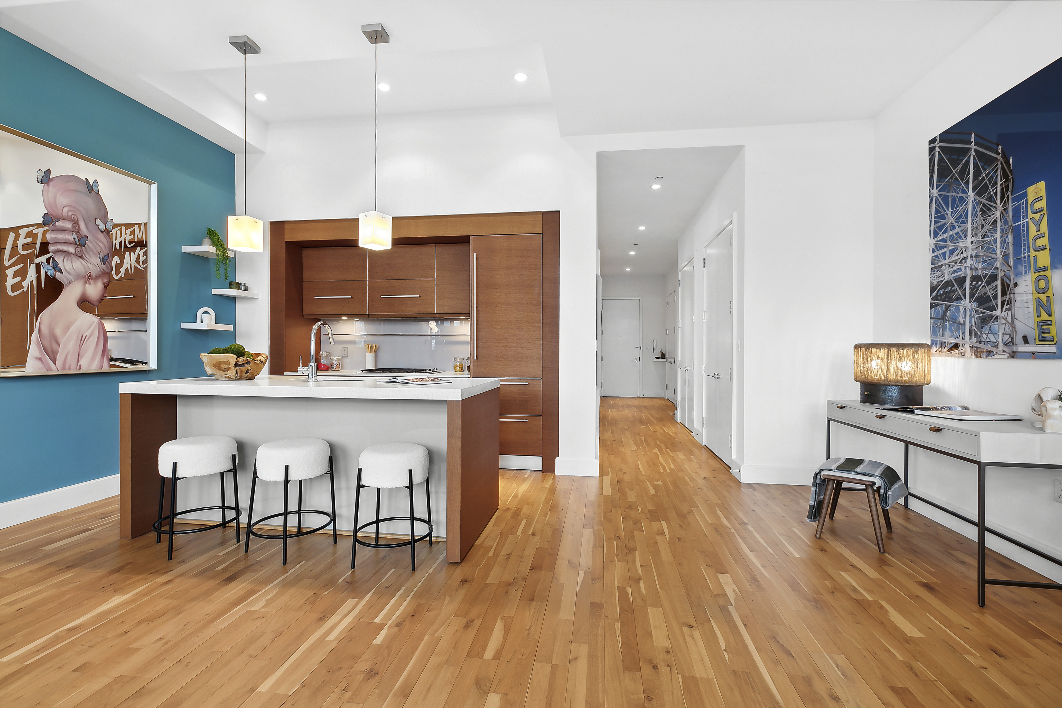 360 Furman Street, Unit 812 Brooklyn, NY 11201 - Photo 4 of 39 a kitchen with stainless steel appliances granite countertop a stove a sink a refrigerator and a dining table with wooden floor