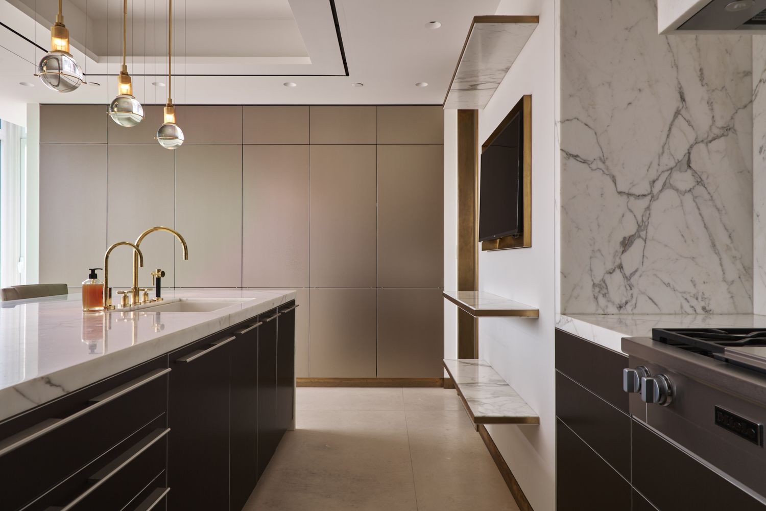 a kitchen with stainless steel appliances a sink and cabinets