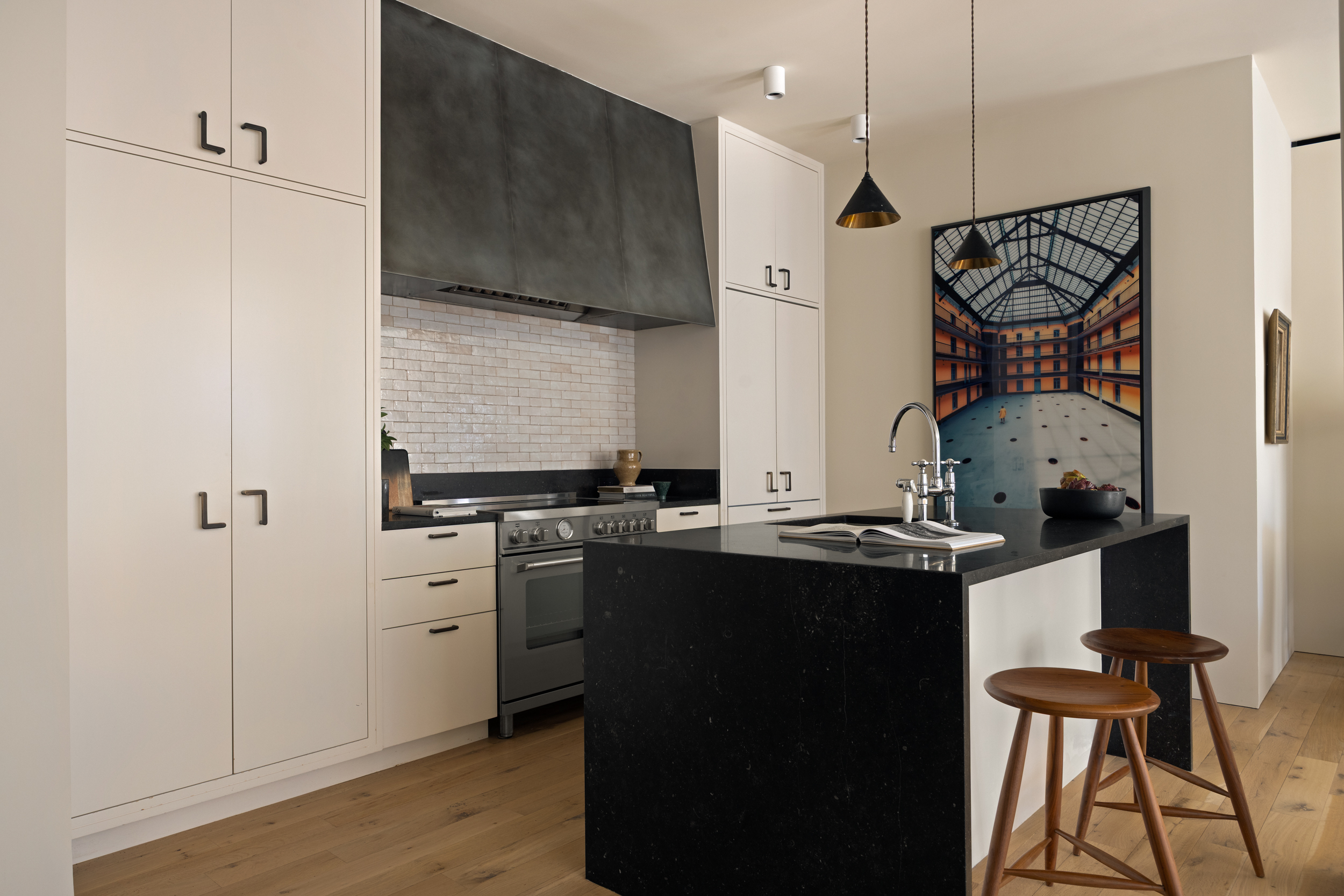 110 Duane Street, Unit PH3S Manhattan, NY 10007 - Photo 7 of 23 a kitchen with stainless steel appliances granite countertop a sink a stove and a refrigerator