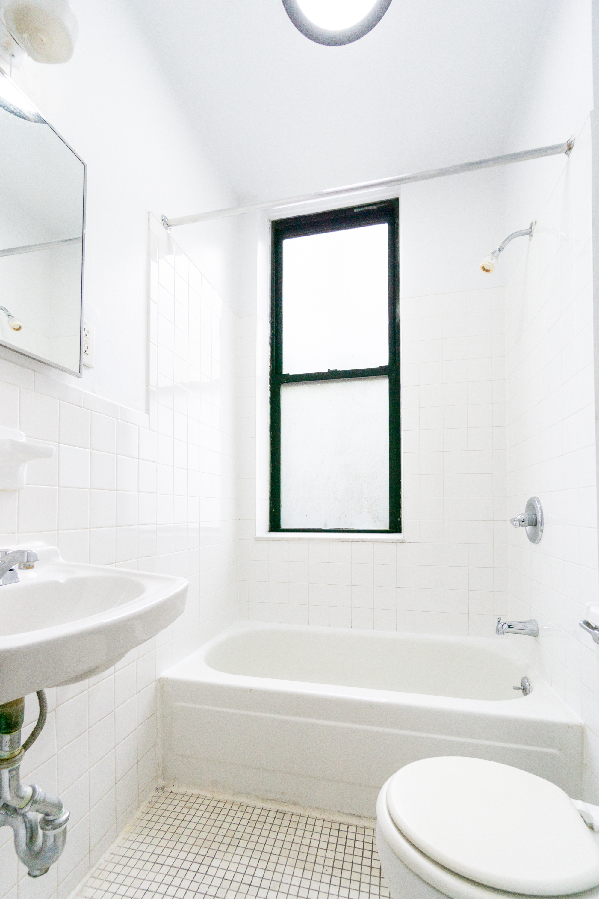 215 East 5th Street, Unit 3 Manhattan, NY 10003 - Photo 20 of 25 a bathroom with a toilet a sink and bathtub
