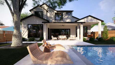 a view of a house with backyard porch and sitting area