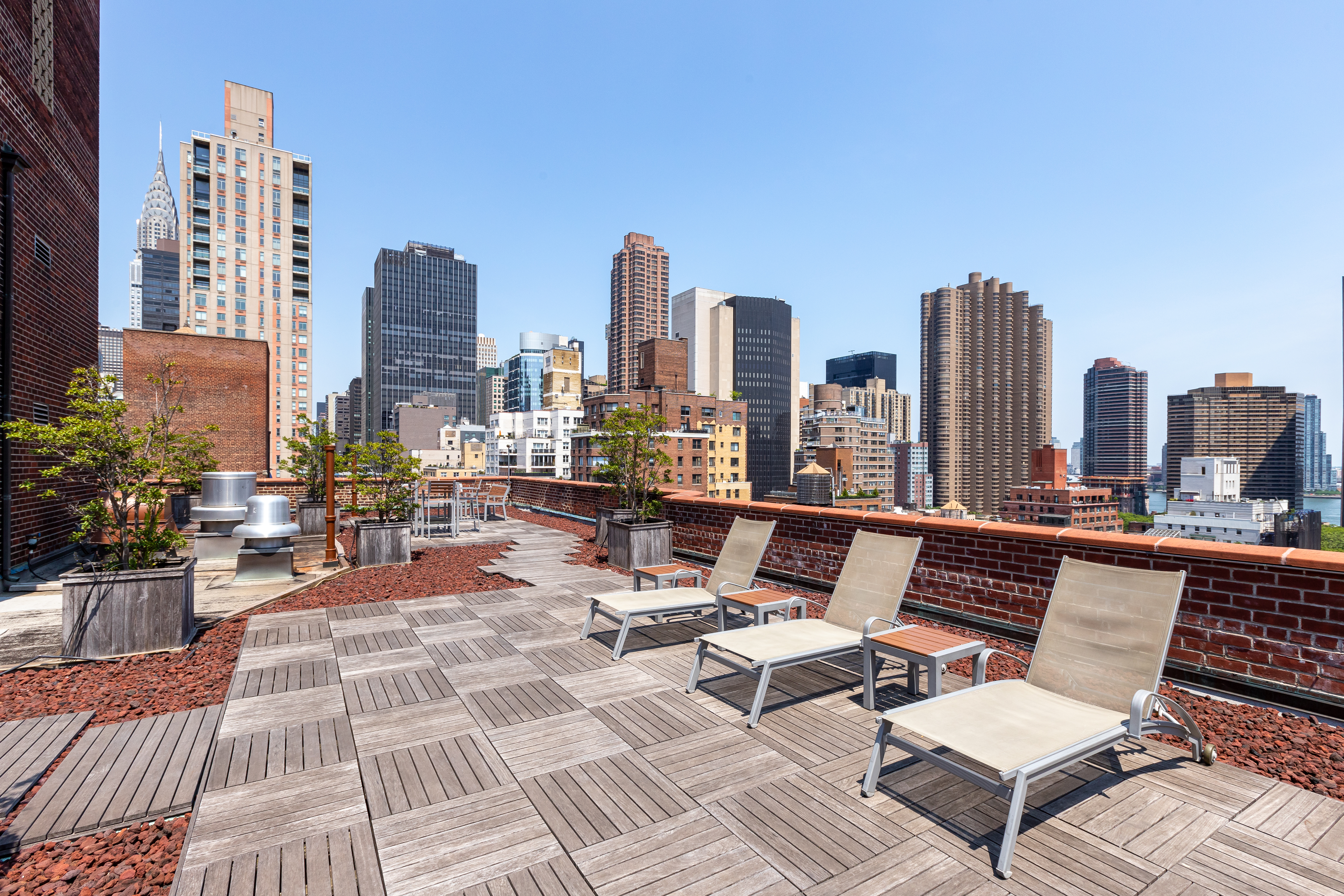 166 East 35th Street, Unit 12C Manhattan, NY 10016 - Photo 6 of 8 a view of a terrace with sitting area