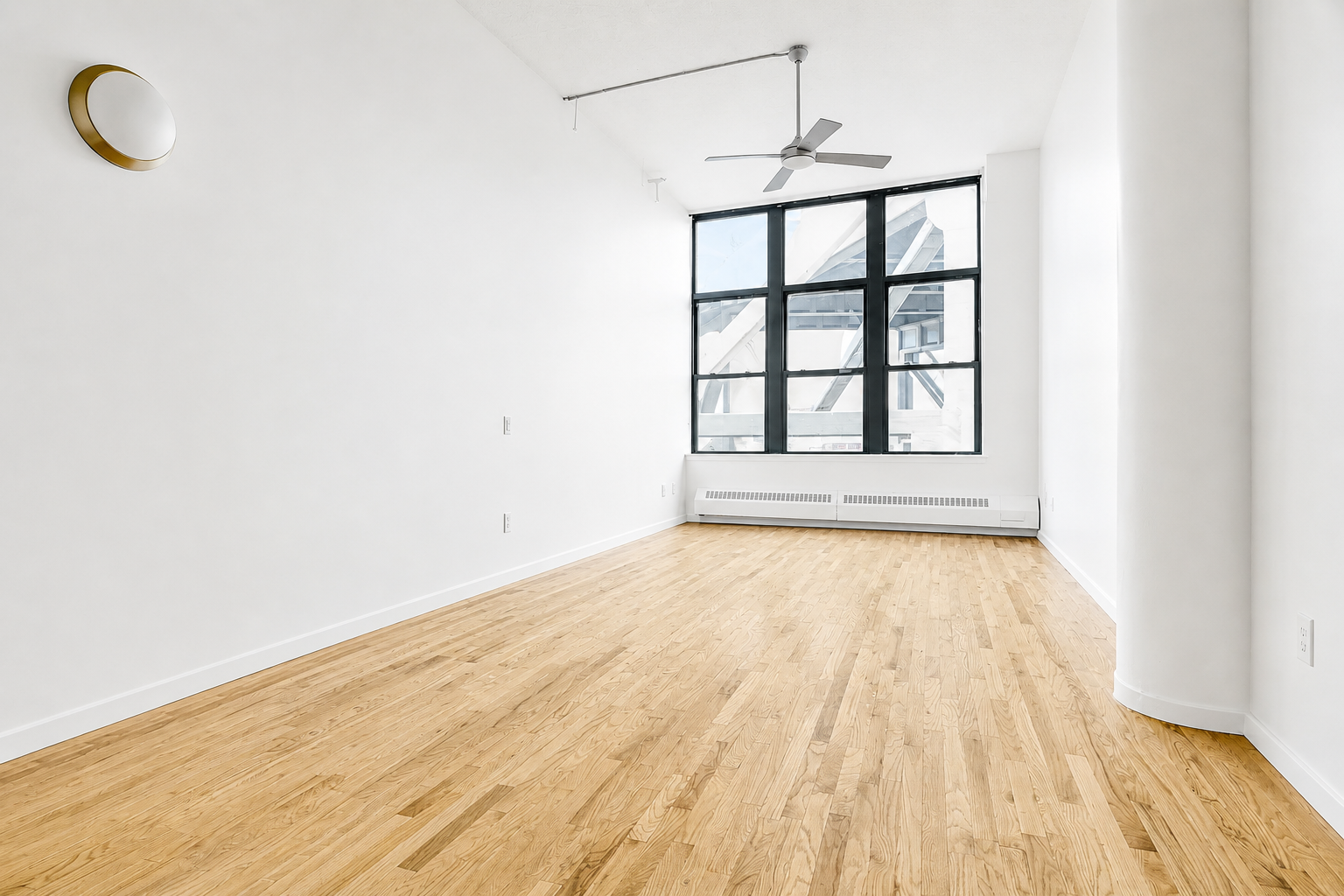 204 Huntington Street, Unit 3E Brooklyn, NY 11231 - Photo 2 of 13 an empty room with wooden floor and windows