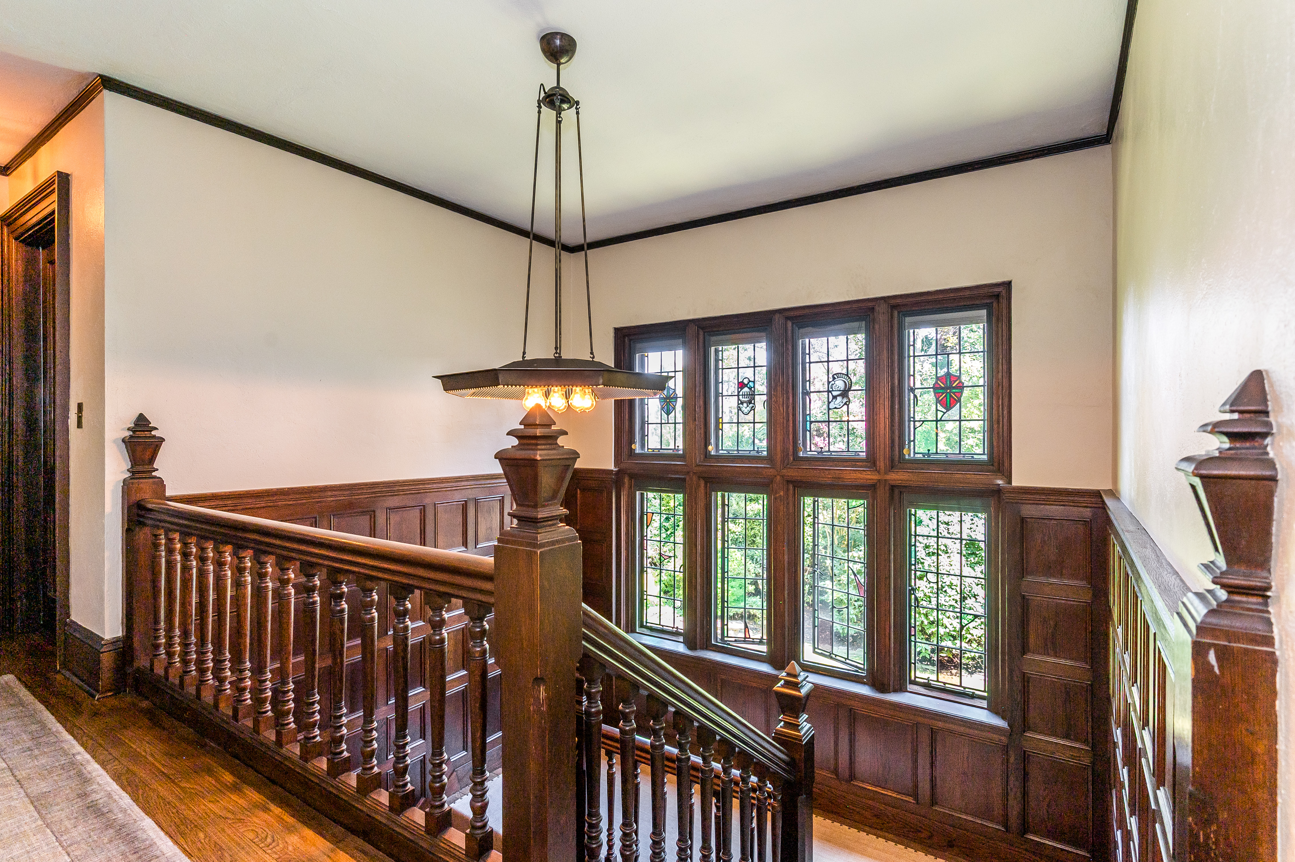 85 Clinton Avenue Montclair, NJ 07042 - Photo 36 of 65 a view of a hallway with wooden floor and chandelier