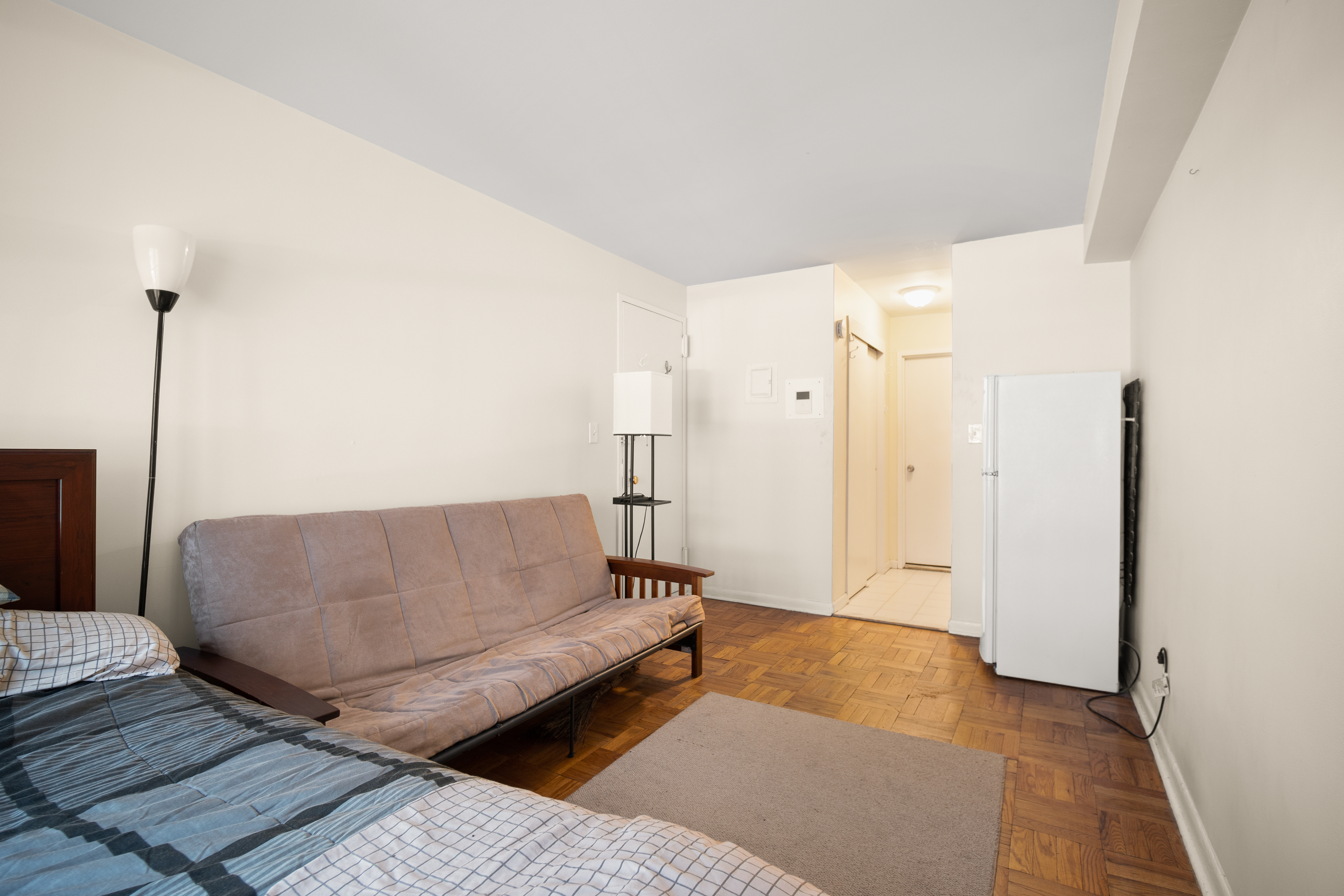 431 East 82nd Street, Unit 1A Manhattan, NY 10028 - Photo 4 of 9 a living room with furniture and a rug